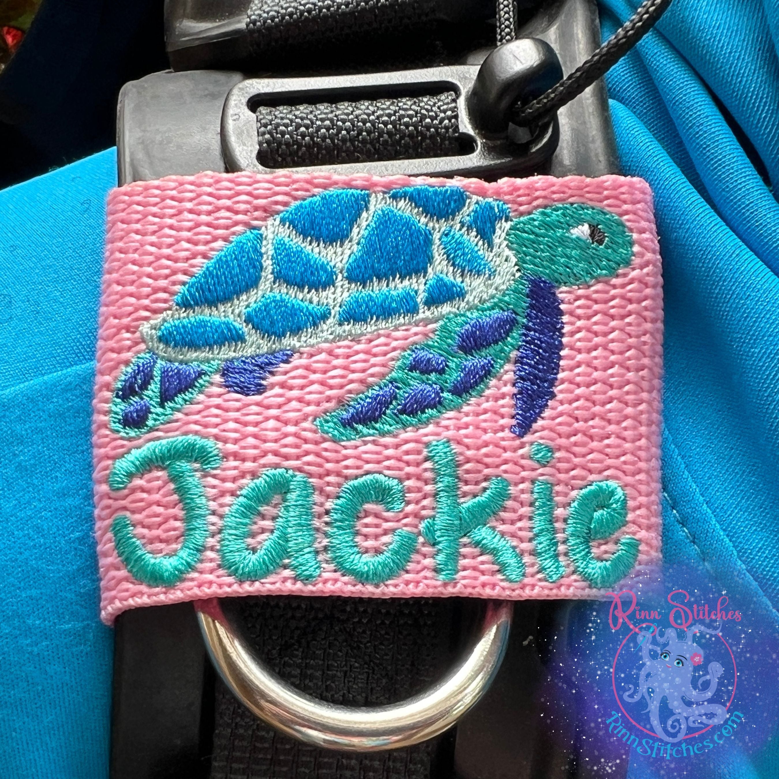 Sea Turtle Personalized BCD Tag by Rinn Stitches on Maui, Hawaii - Small BCD Jacket Size in Pink Webbing featuring the name Jackie in Teal Thread in our Sand Castle Font