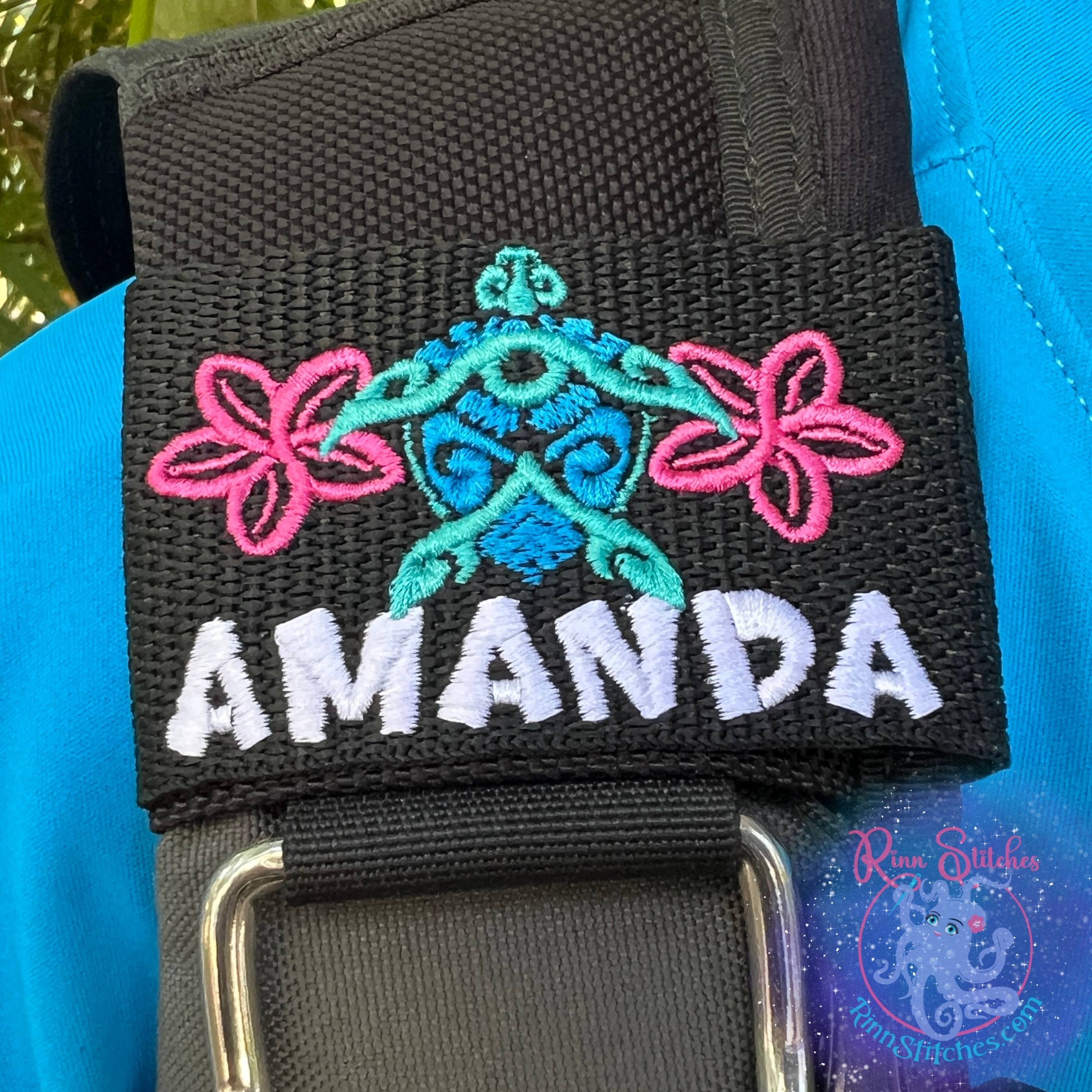 Hawaiian Sea Turtle (Honu) Tiki with Plumerias Personalized BCD Tag with - name Amanda in white thread in our Turtles Rock Font by Rinn Stitches on Maui