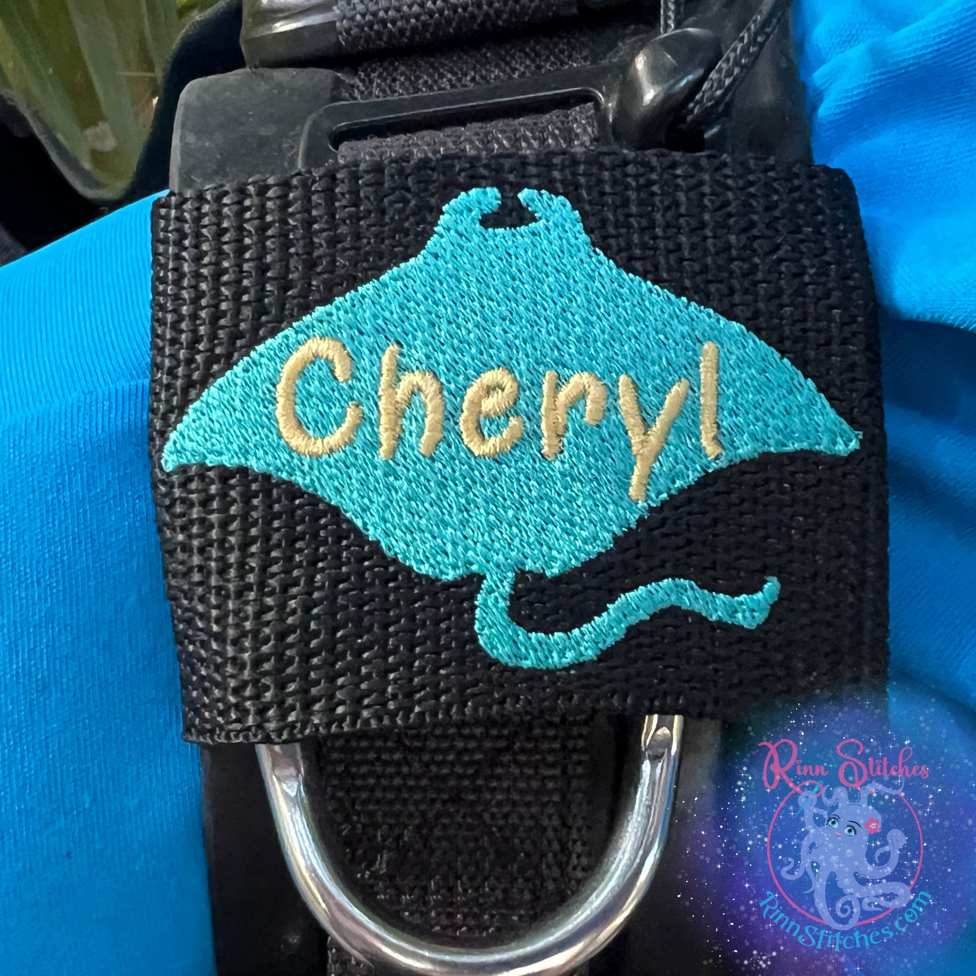 Manta Ray Silhouette Personalized BCD Tag by Rinn Stitches on Maui, Hawaii on a Scuba Pro Hydros BCD Teal Manta Ray with Gold Name