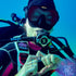 Scuba Diving Regulator Tag featuring the name Megin on a Scuba Diver under water. Made by Rinn Stitches on Maui, Hawaii