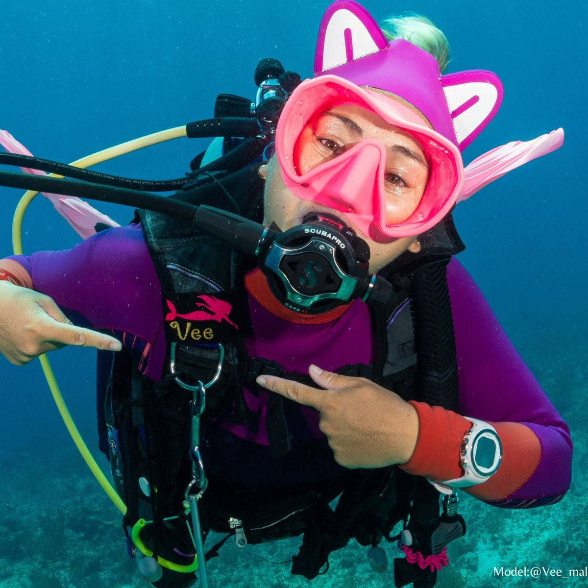 Scuba diver wearing a Mermaid BCD Tag in Neon Pink with the name Vee embroidered below it in Gold. Made by Rinn Stitches in Maui, Hawaii