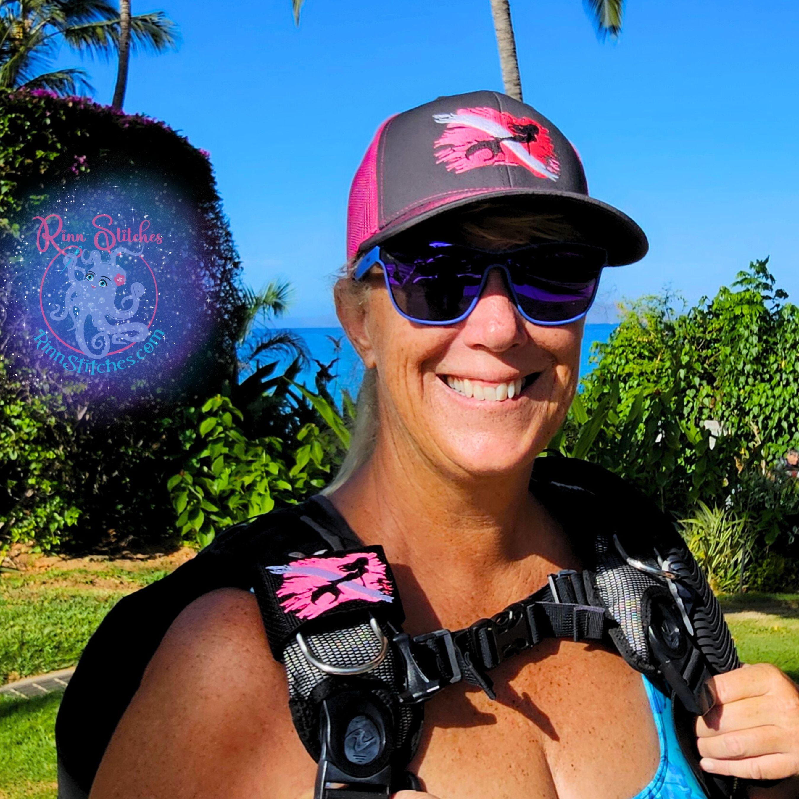 Neon Pink and white dive flag embroidered design with a black mermaid silhouette in the middle of the flag and matching embroidered cap. Made by Rinn Stitches in Maui, Hawaii