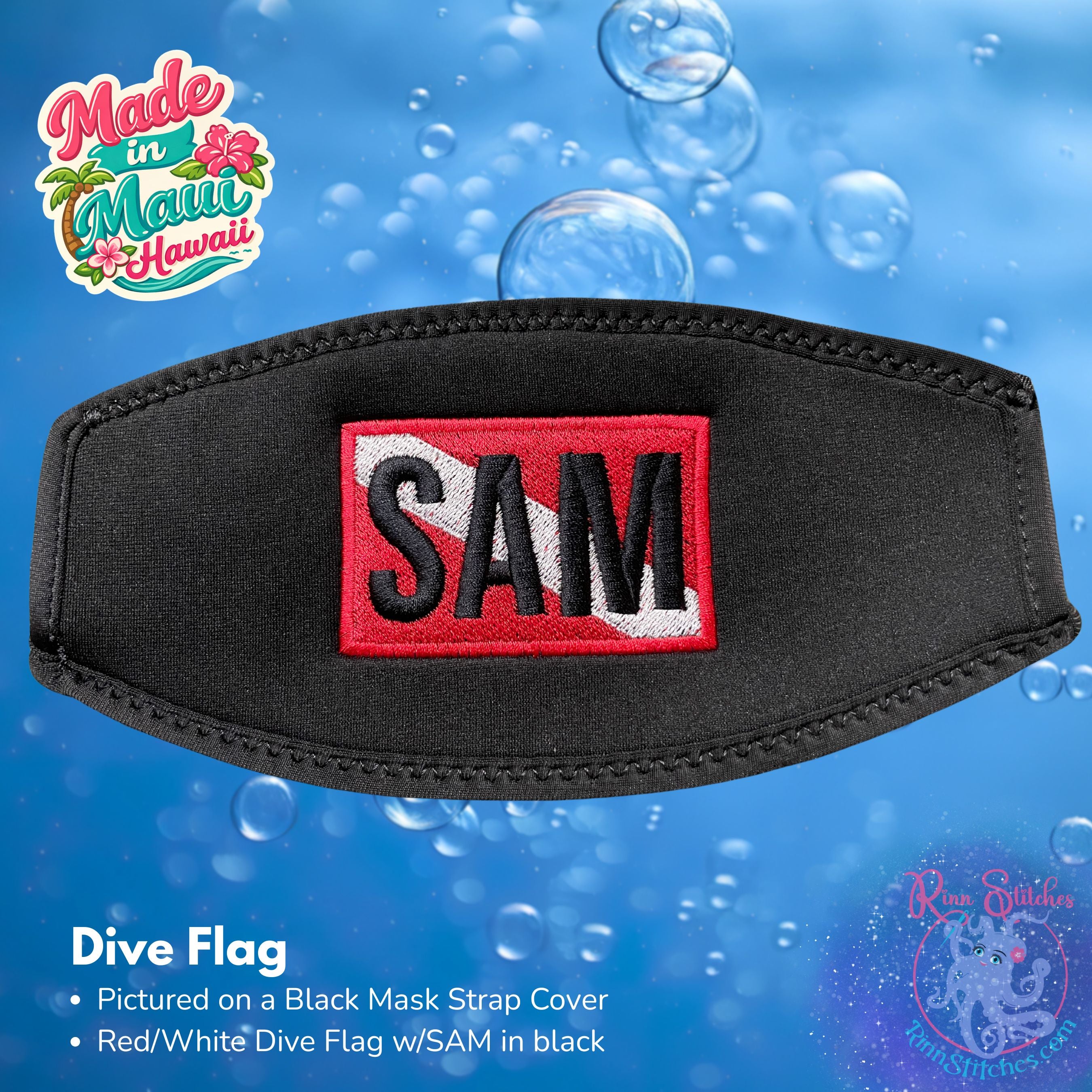 A black neoprene mask strap cover with an embroidered red/white dive flag with SAM in black. 