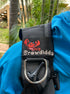 Embroidered BCD Tag featuring a red and coral crawdad design in a cute cartoon style with the name Crawdiddy on the bottom in beach sand color thread. Made by Rinn Stitches in Maui, Hawaii